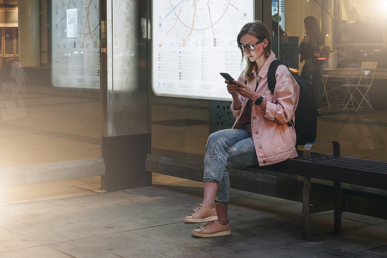 Women sitting at a VALO smart bus stop